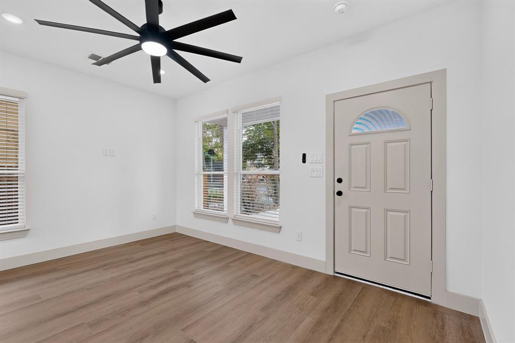 103 Cherokee Street Terrell, TX 75160 - Photo 7 of 40 Recessed lighting, wood-finish flooring, and a large ceiling fan with integrated lighting