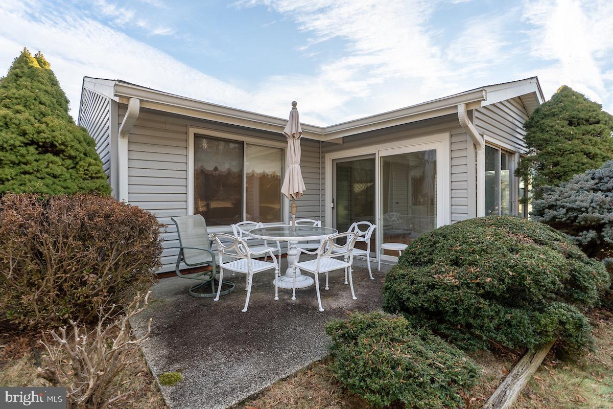 3507 Tarkington Lane, Unit 66A Silver Spring, MD 20906 - Photo 14 of 39 a view of a house with patio and a garden