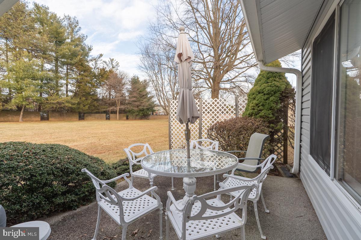 3507 Tarkington Lane, Unit 66A Silver Spring, MD 20906 - Photo 15 of 39 a view of a patio with table and chairs and potted plants