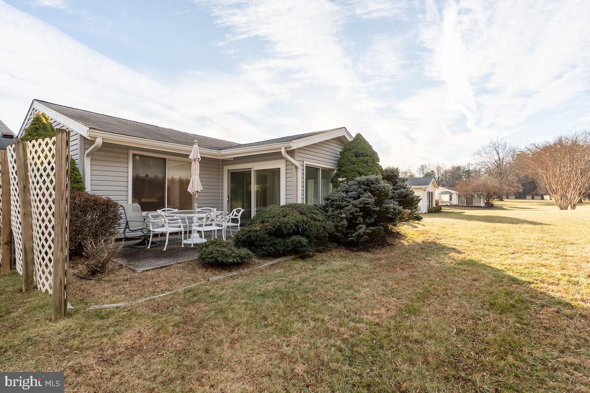 3507 Tarkington Lane, Unit 66A Silver Spring, MD 20906 - Photo 16 of 39 a view of a house with backyard porch and furniture