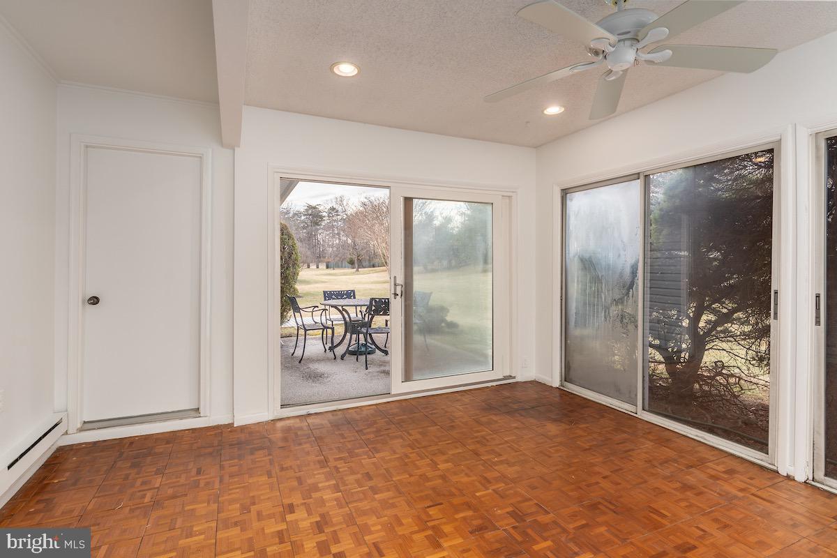 3507 Tarkington Lane, Unit 66A Silver Spring, MD 20906 - Photo 20 of 39 en empty room with large mirror and furniture