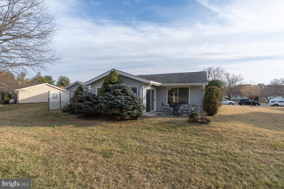 3507 Tarkington Lane, Unit 66A Silver Spring, MD 20906 - Photo 27 of 39 a view of a house with backyard and a tree
