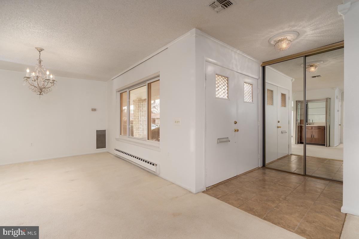 3507 Tarkington Lane, Unit 66A Silver Spring, MD 20906 - Photo 6 of 39 wooden floor in an empty room with a window