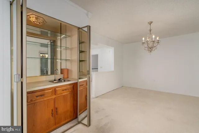 a room that has a lot of cabinets and washer