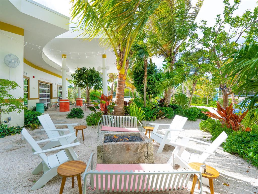 615 Buttonwood Drive Longboat Key, FL 34228 - Photo 36 of 43 a view of an chairs and tables in the patio