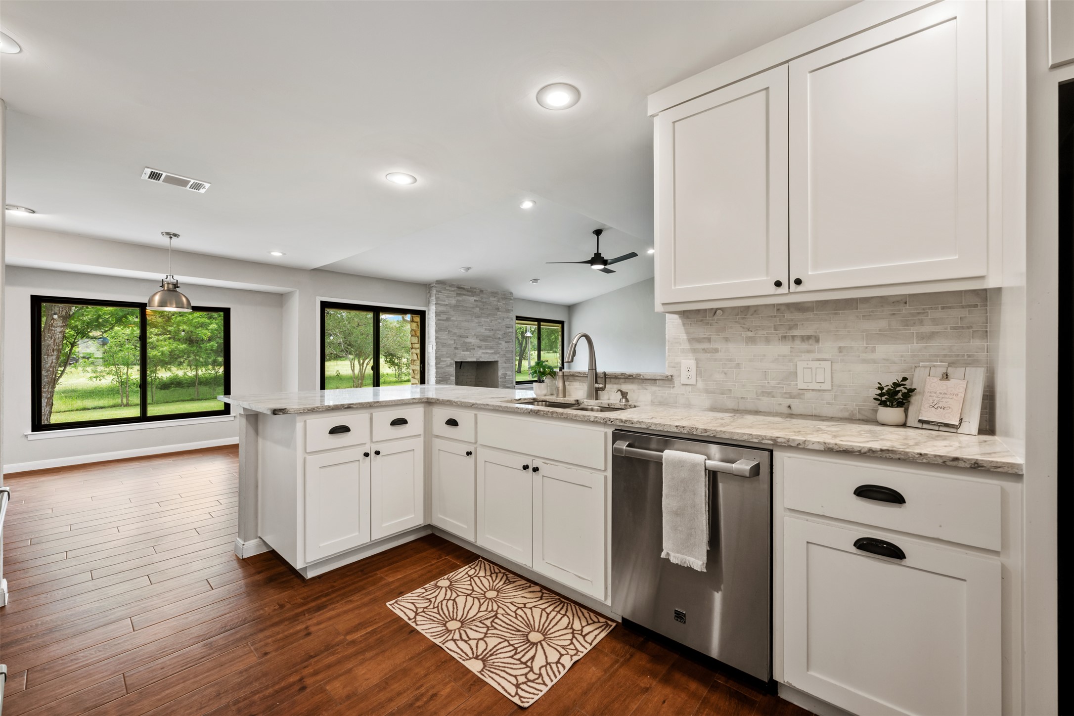 1600 Pin Oak Lane Round Rock, TX 78681 - Photo 20 of 40 Kitchen featuring white shaker-style cabinetry, light-toned countertops, and a full tile backsplash