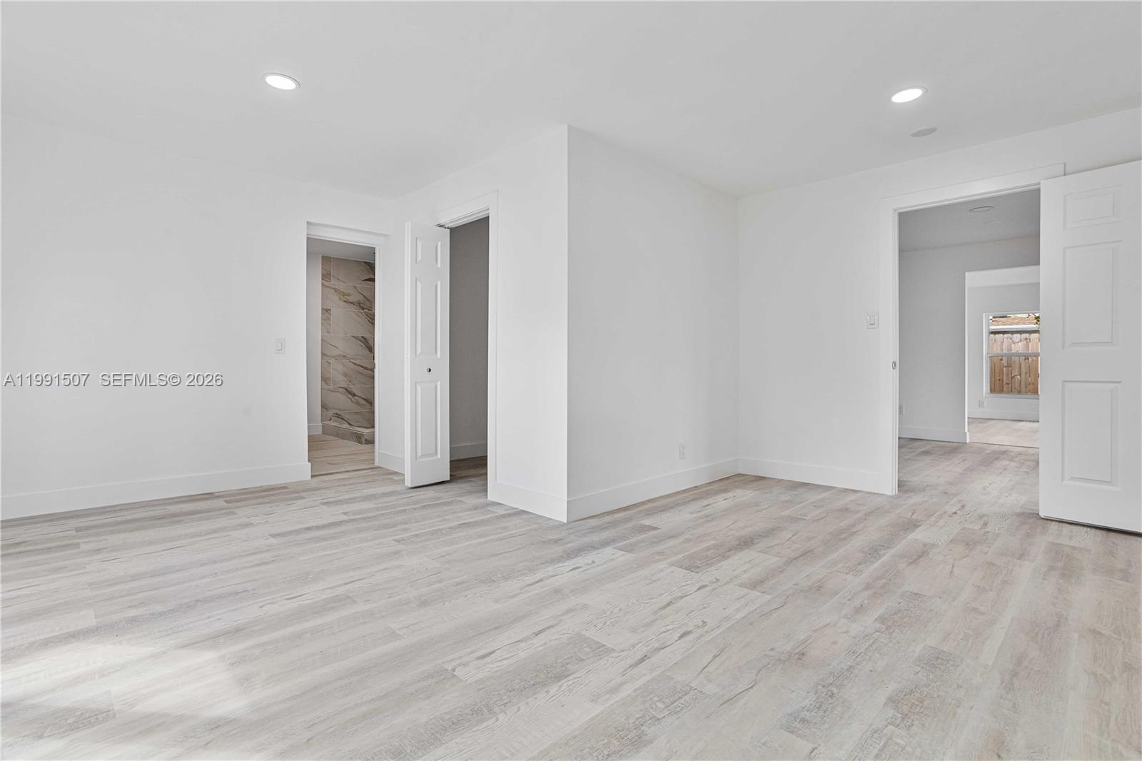 4157 Southwest 49th Court Dania Beach, FL 33314 - Photo 19 of 46 a view of an empty room with wooden floor