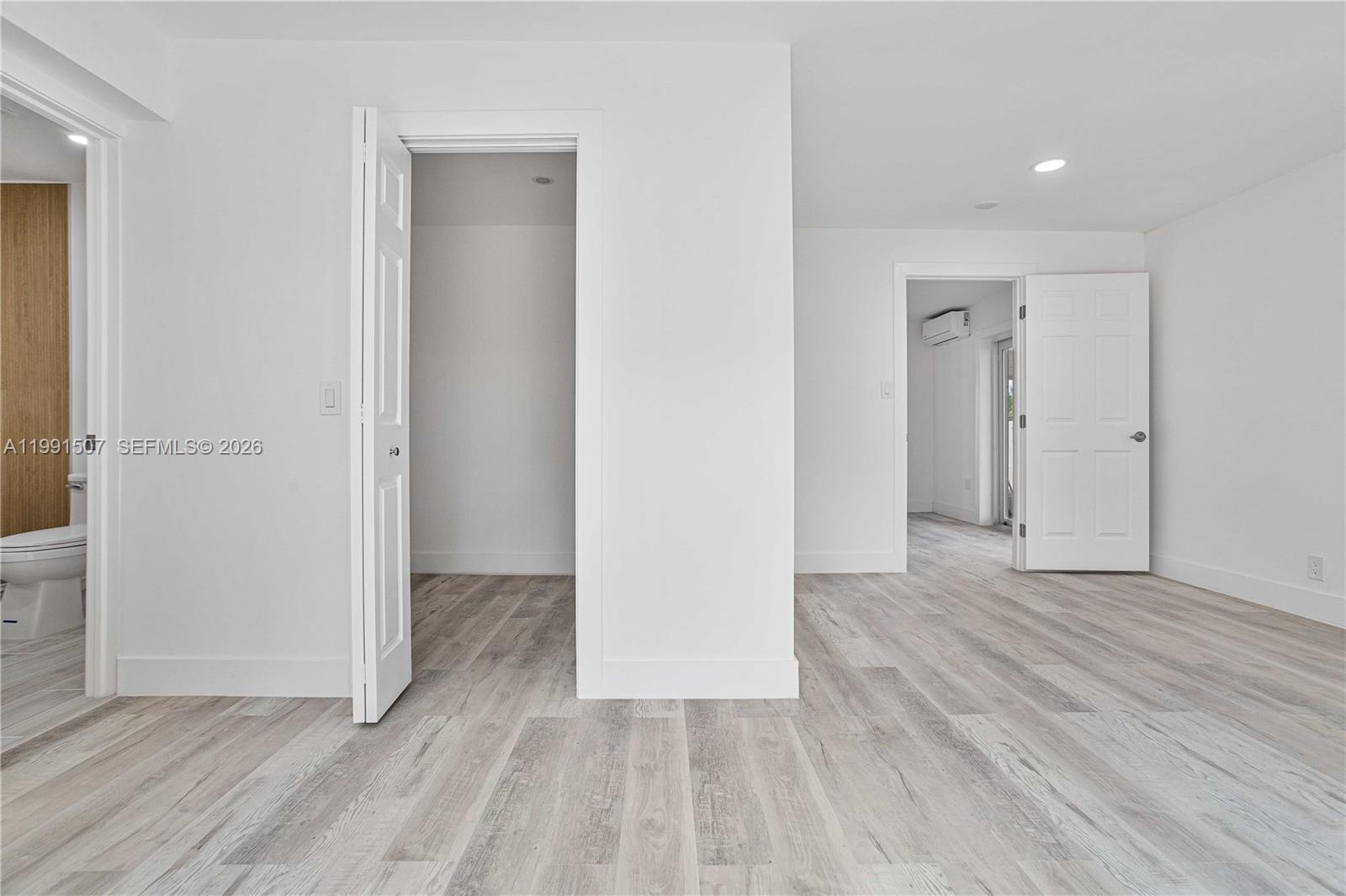4157 Southwest 49th Court Dania Beach, FL 33314 - Photo 20 of 46 an empty room with wooden floor & closet area