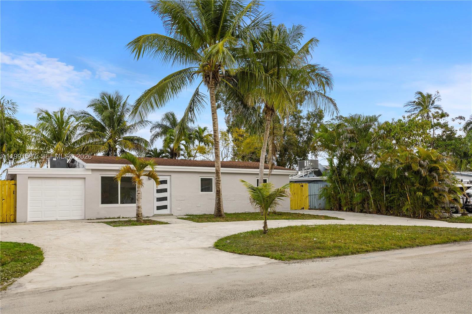 4157 Southwest 49th Court Dania Beach, FL 33314 - Photo 2 of 46 a view of a house with a yard