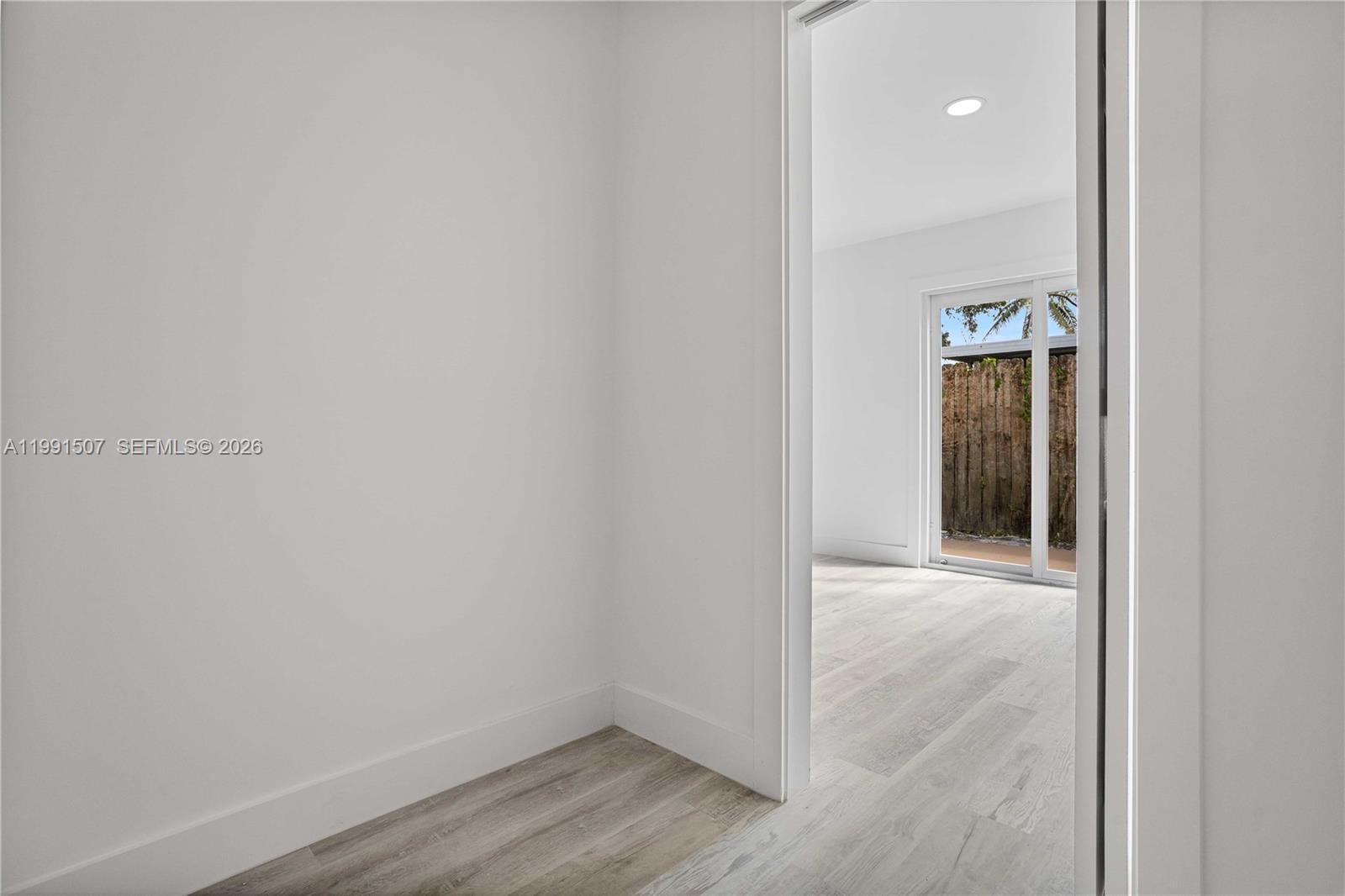 4157 Southwest 49th Court Dania Beach, FL 33314 - Photo 21 of 46 a view of an empty room with wooden floor and closet