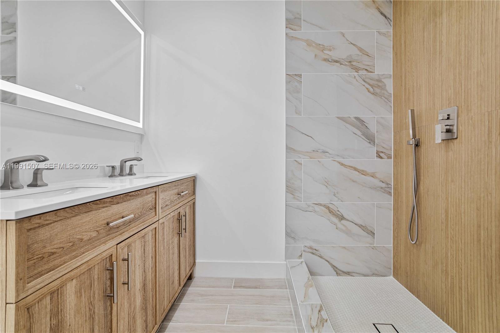 4157 Southwest 49th Court Dania Beach, FL 33314 - Photo 23 of 46 a bathroom with a sink a toilet and shower