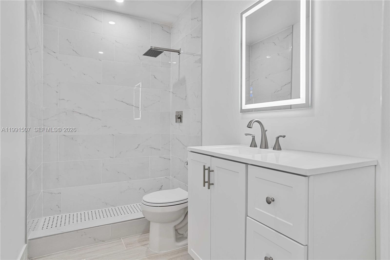 4157 Southwest 49th Court Dania Beach, FL 33314 - Photo 26 of 46 a bathroom with a sink a toilet and shower