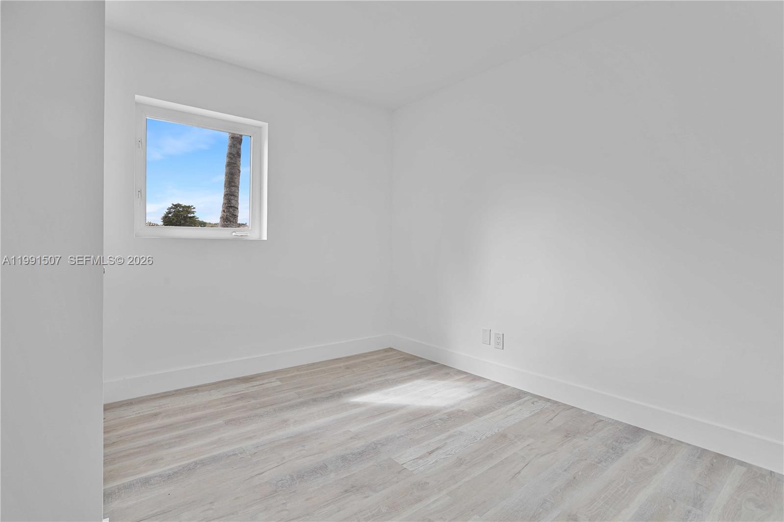 4157 Southwest 49th Court Dania Beach, FL 33314 - Photo 28 of 46 a view of a small space with wooden floor and a window