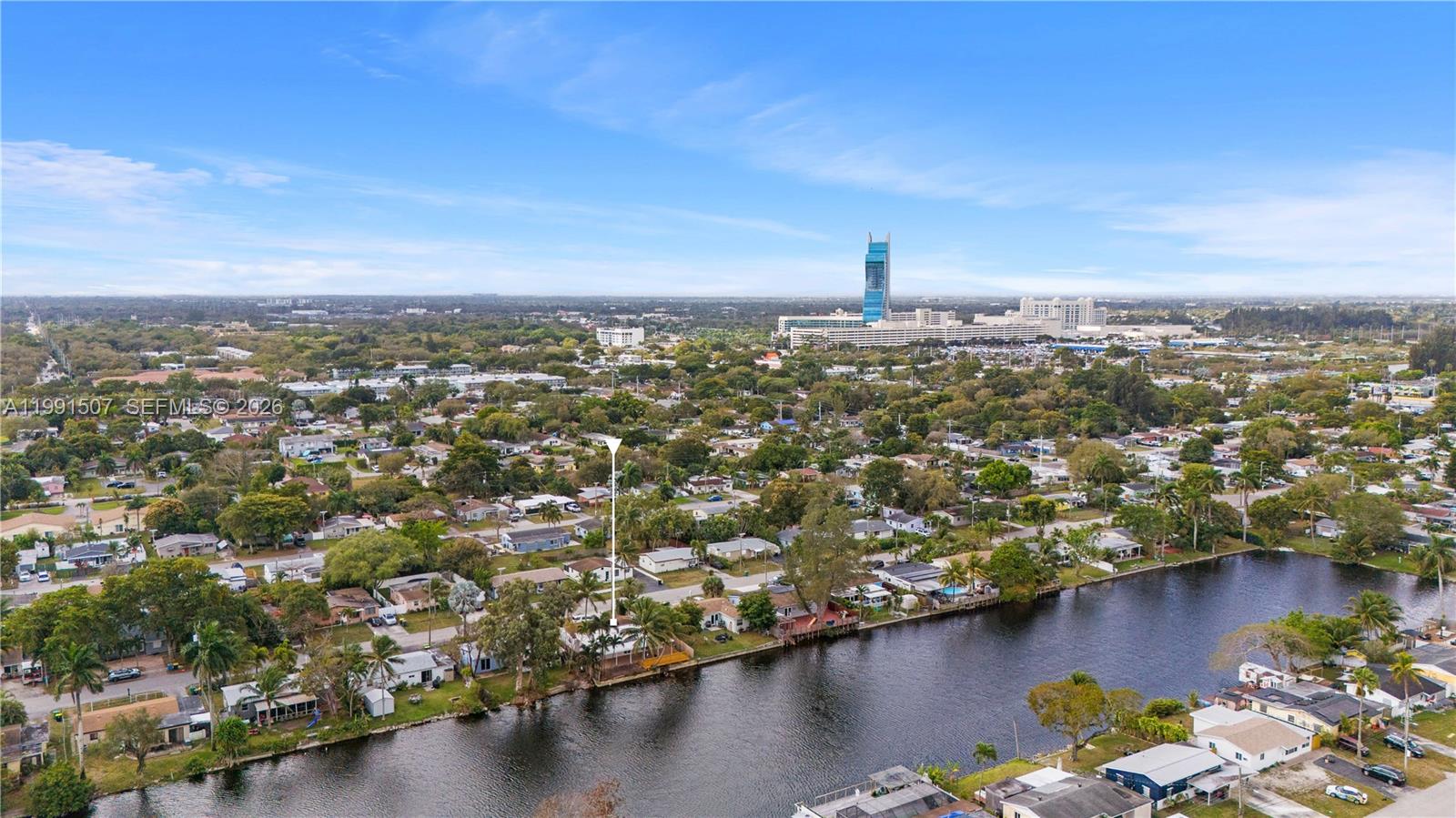 4157 Southwest 49th Court Dania Beach, FL 33314 - Photo 3 of 46 an aerial view of residential building with outdoor space and lake view