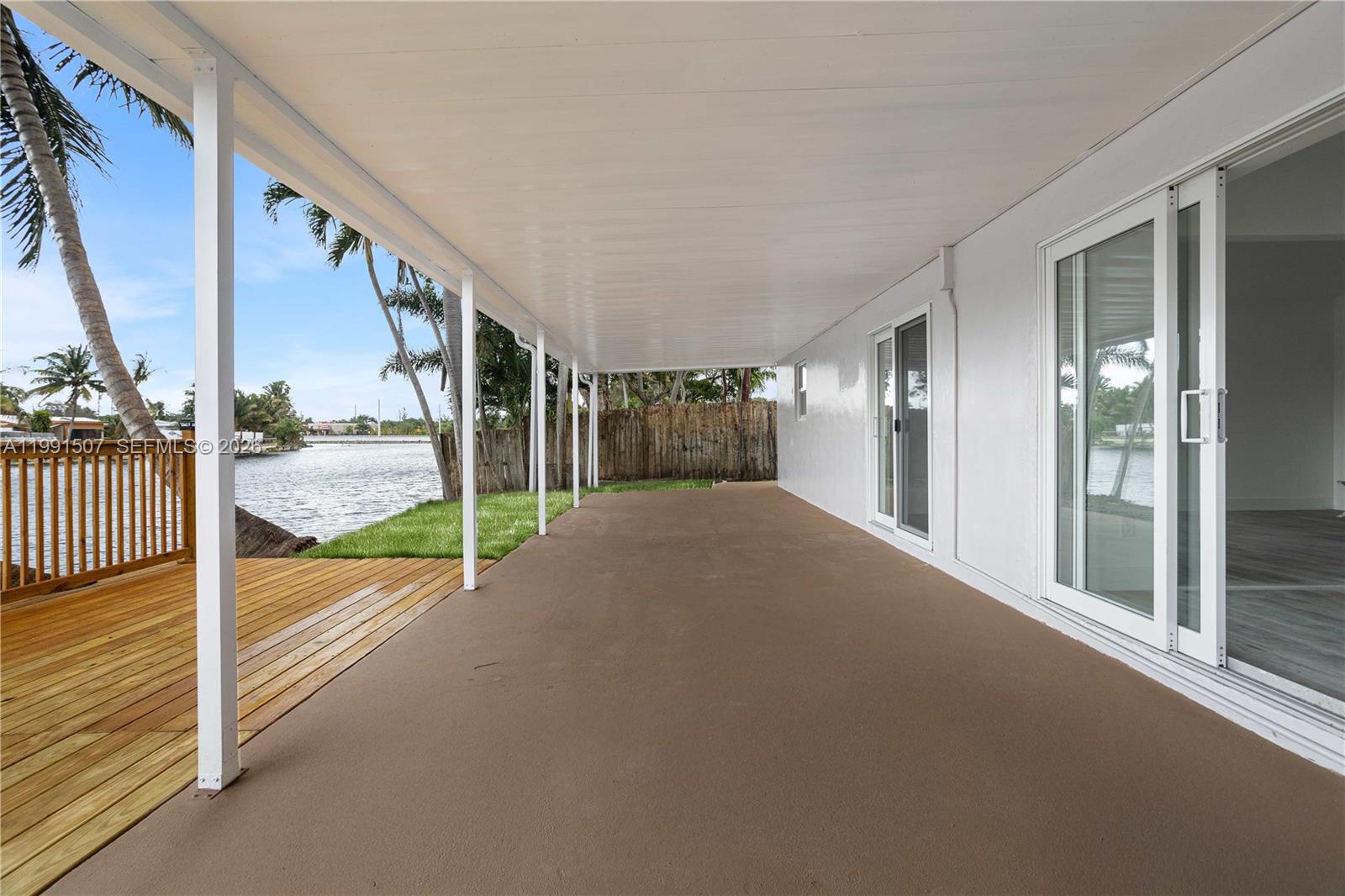 4157 Southwest 49th Court Dania Beach, FL 33314 - Photo 35 of 46 a view of porch and floor to ceiling window