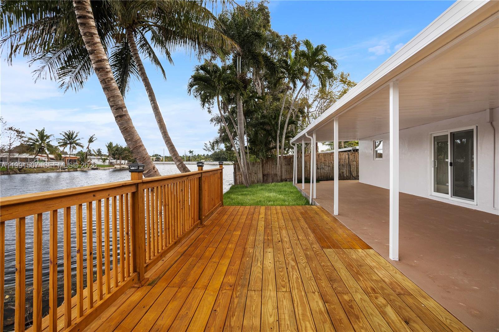 4157 Southwest 49th Court Dania Beach, FL 33314 - Photo 40 of 46 a view of a house with backyard and wooden bridge