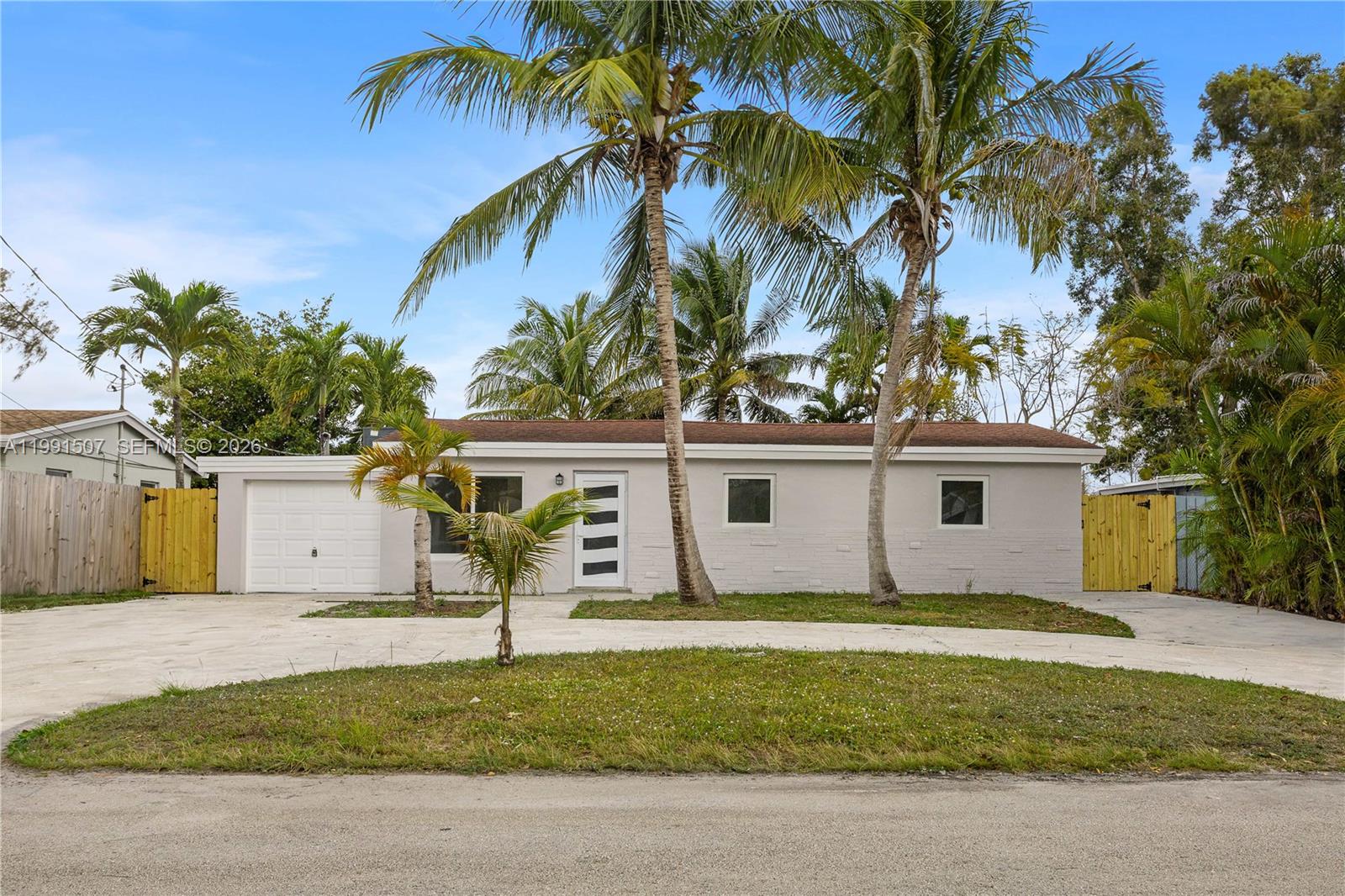 4157 Southwest 49th Court Dania Beach, FL 33314 - Photo 41 of 46 a view of a house with a yard