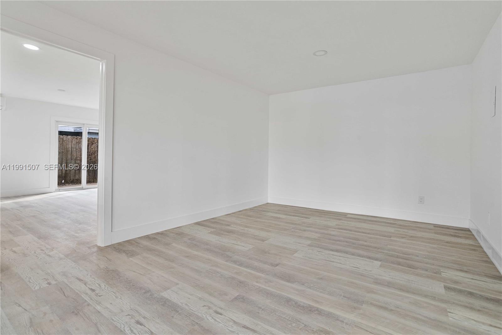 4157 Southwest 49th Court Dania Beach, FL 33314 - Photo 10 of 46 a view of an empty room and wooden floor