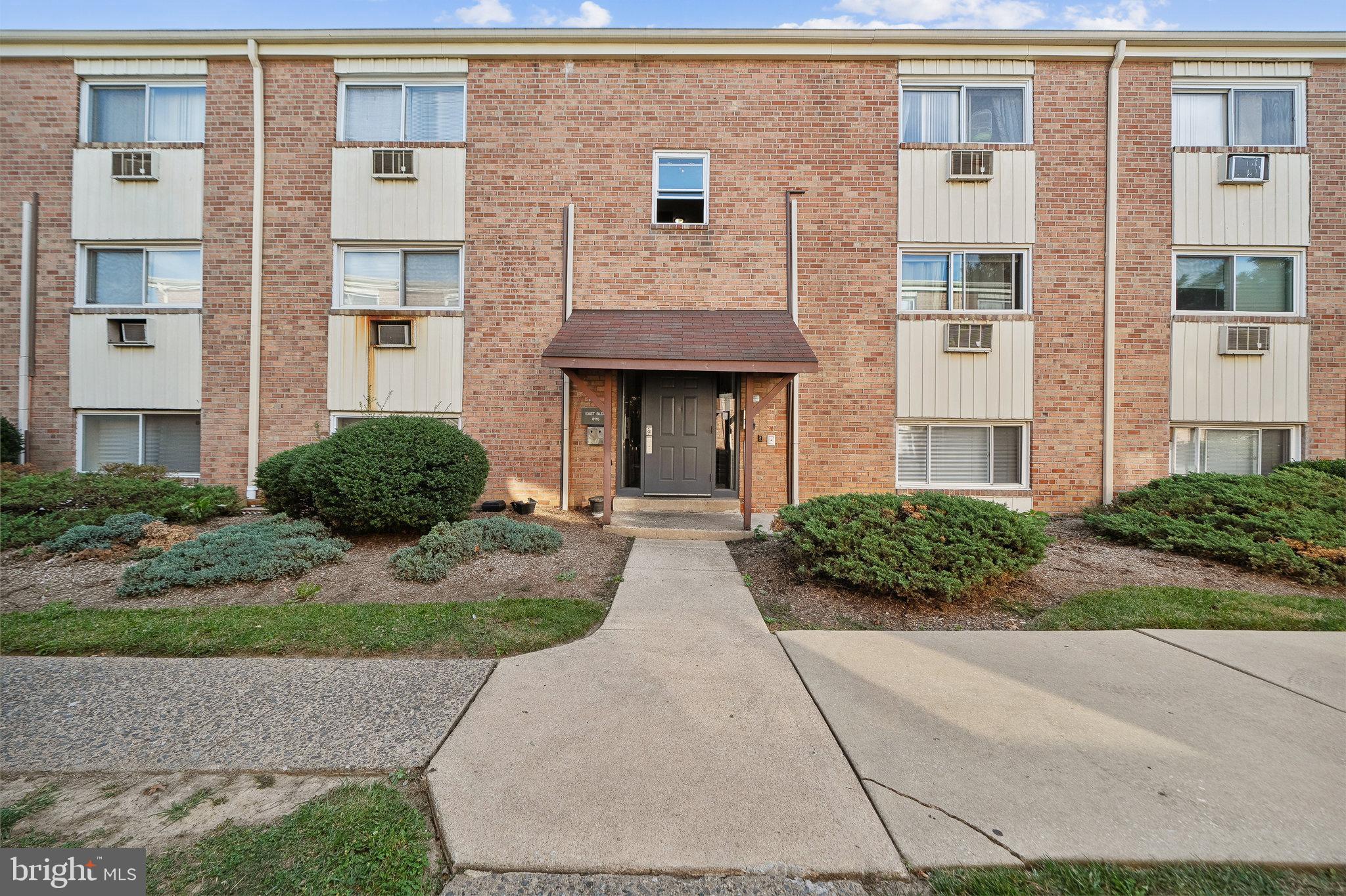 8115 West Chester Pike, Unit B5E Upper Darby, PA 19082 - Photo 26 of 29 Main building entrance in the courtyard