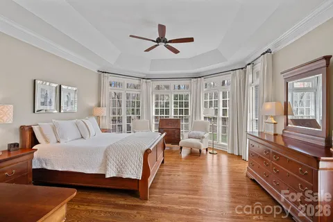 a living room with furniture a rug a flat screen tv and a fireplace