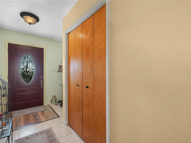 a view of front door with a mirror