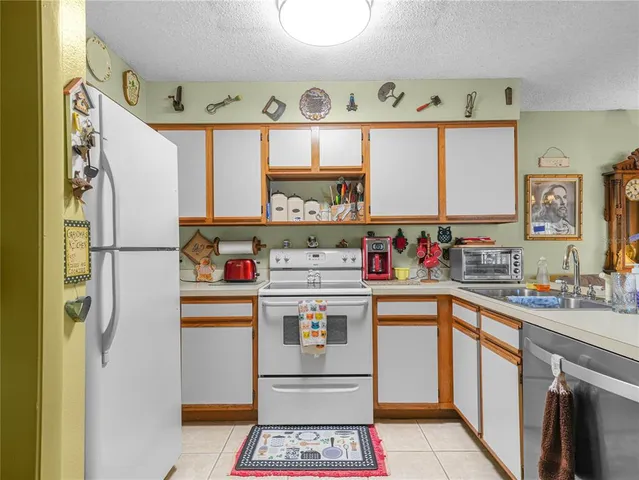 a kitchen with stainless steel appliances a stove and a refrigerator