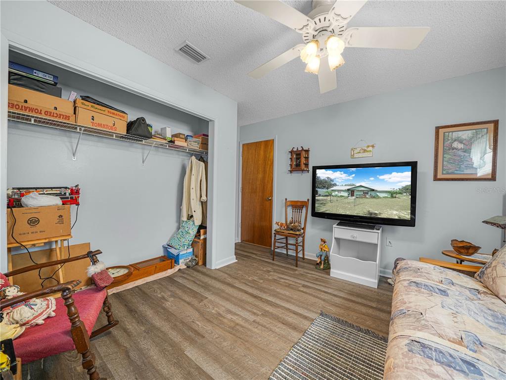 1100 Golden Bough Road Lake Wales, FL 33898 - Photo 21 of 49 a living room with furniture and a flat screen tv