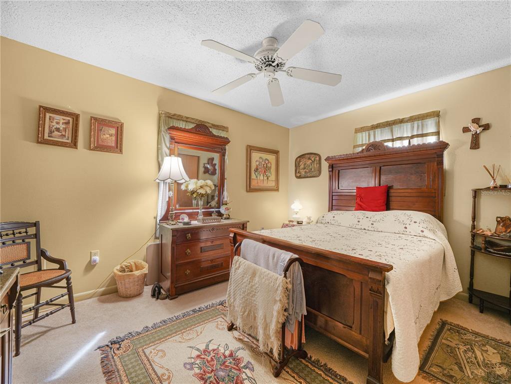 1100 Golden Bough Road Lake Wales, FL 33898 - Photo 22 of 49 a bed room with a bed and a chandelier