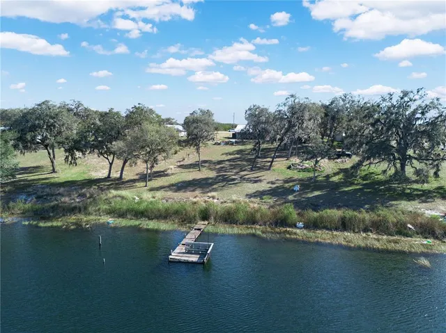 a view of lake with green space