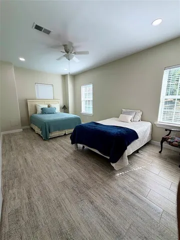 a bedroom with a bed and window