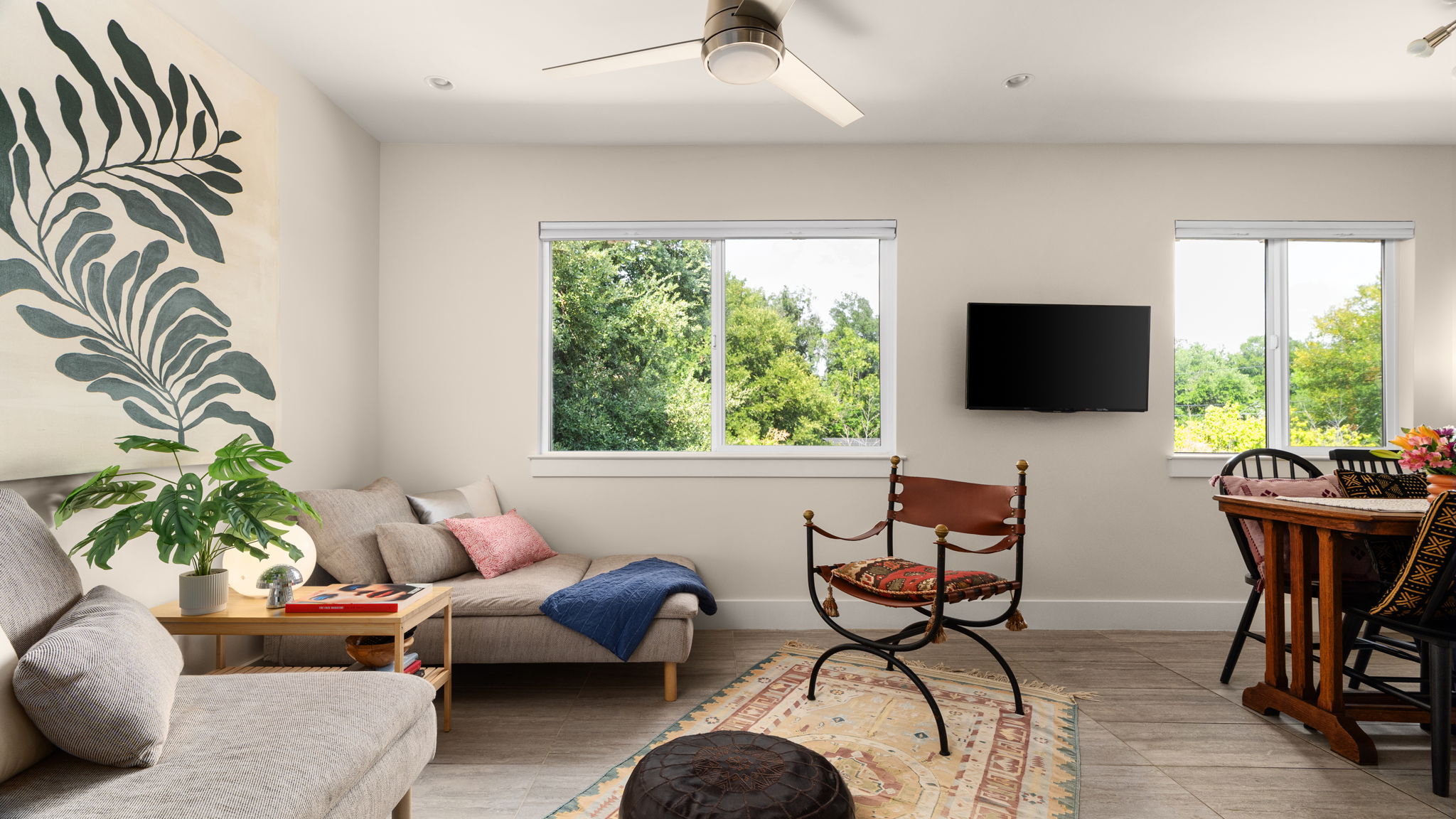 1208 Enfield Road, Unit 204 Austin, TX 78703 - Photo 2 of 21 a living room with furniture and a flat screen tv