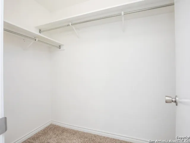 a view of an empty walk in closet
