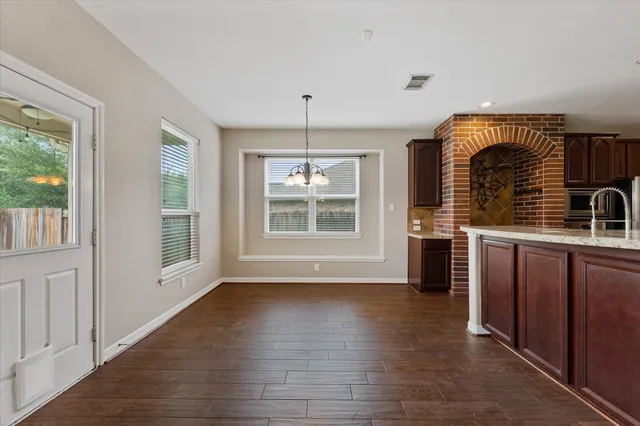 a view of a livingroom with a ceiling fan and window