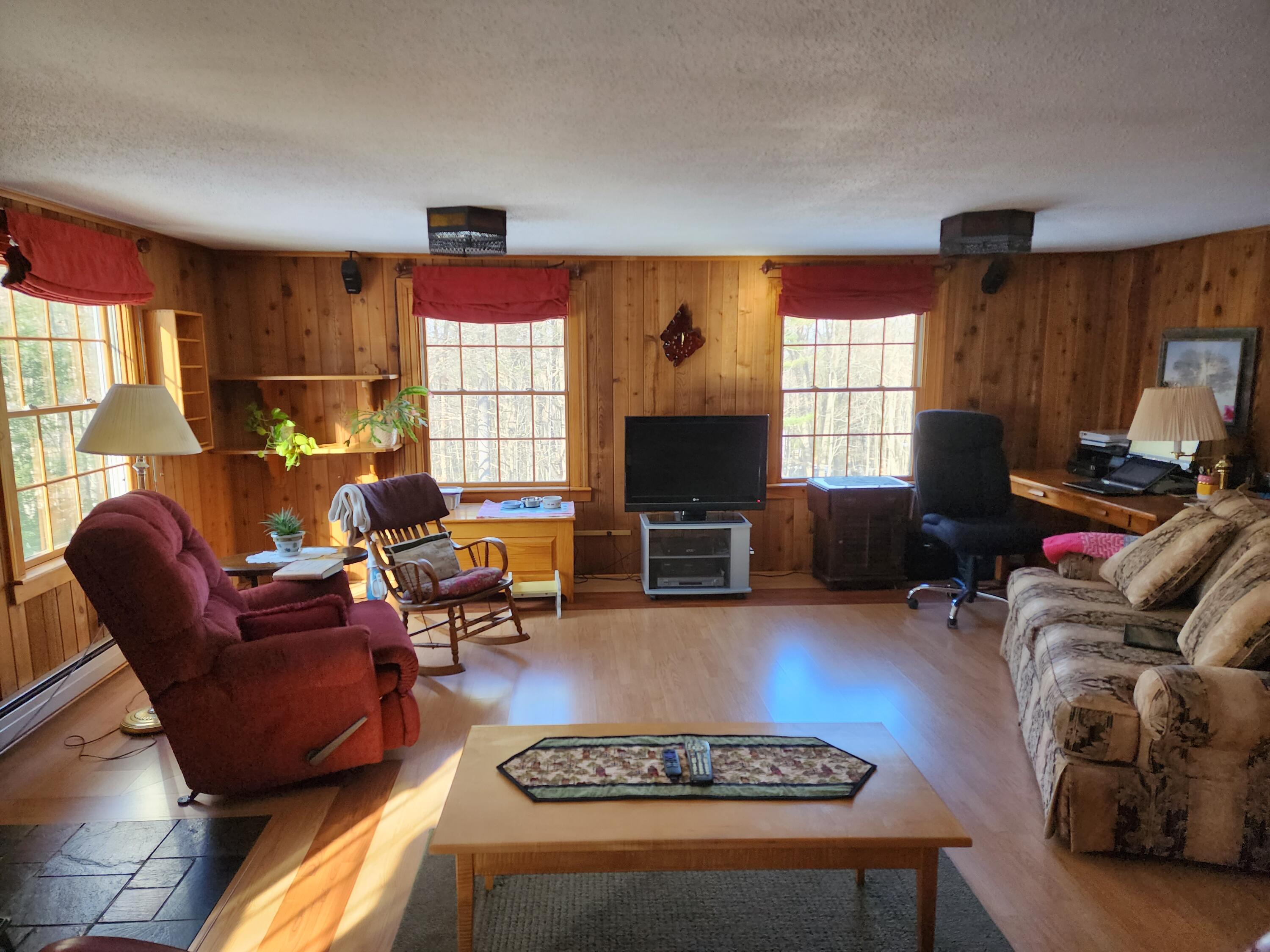 5 Riverview Road Jay, ME 04239 - Photo 22 of 46 Living Room w/ Pellet Stove.