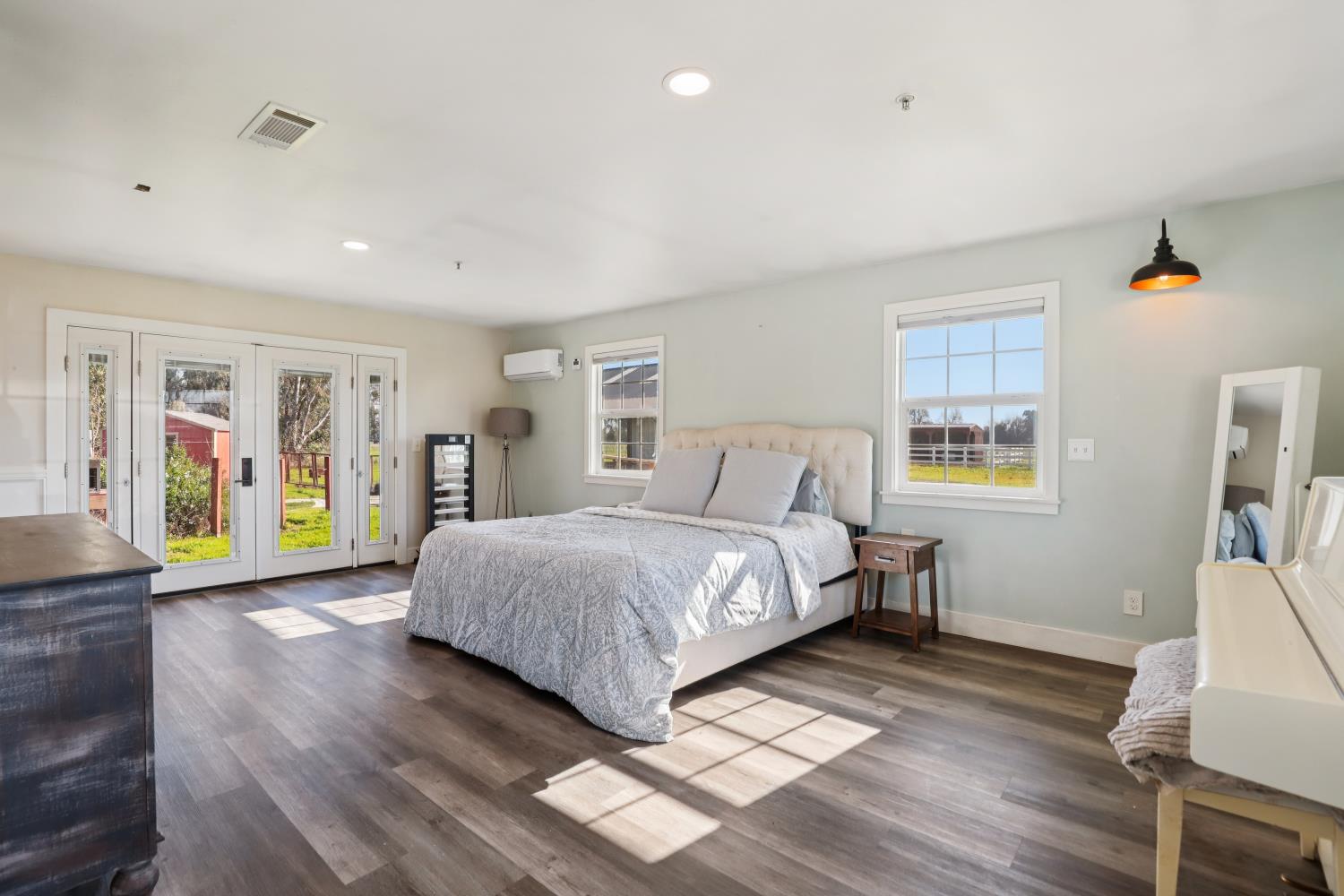 11213 Colony Road Wilton, CA 95693 - Photo 13 of 48 a bedroom with a bed and wooden floor