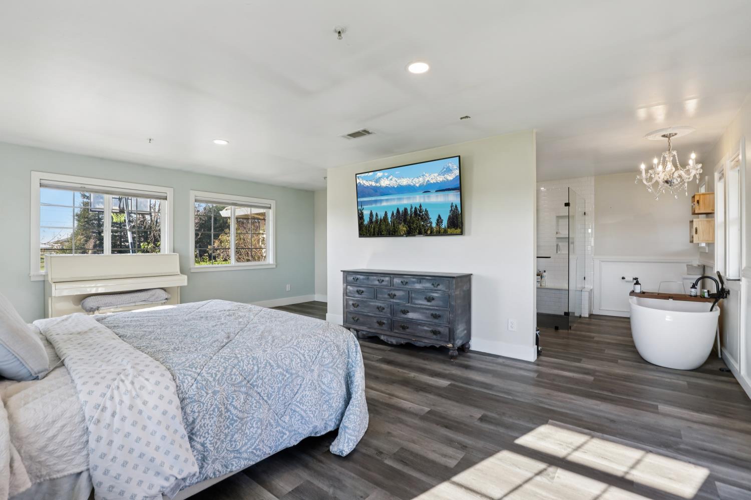 11213 Colony Road Wilton, CA 95693 - Photo 15 of 48 a bedroom with a bed and a couch