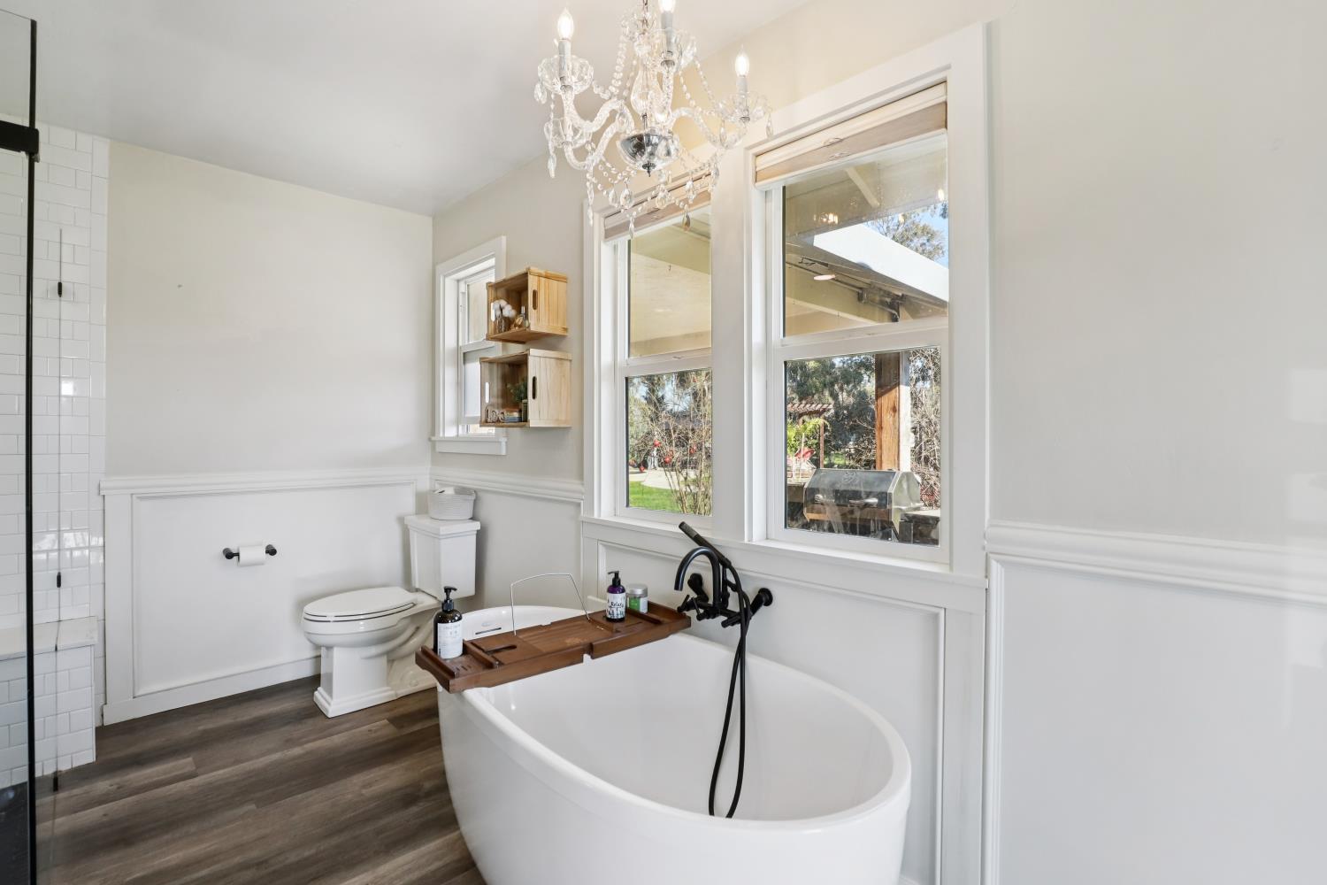 11213 Colony Road Wilton, CA 95693 - Photo 18 of 48 a bath room with a sink and a large mirror