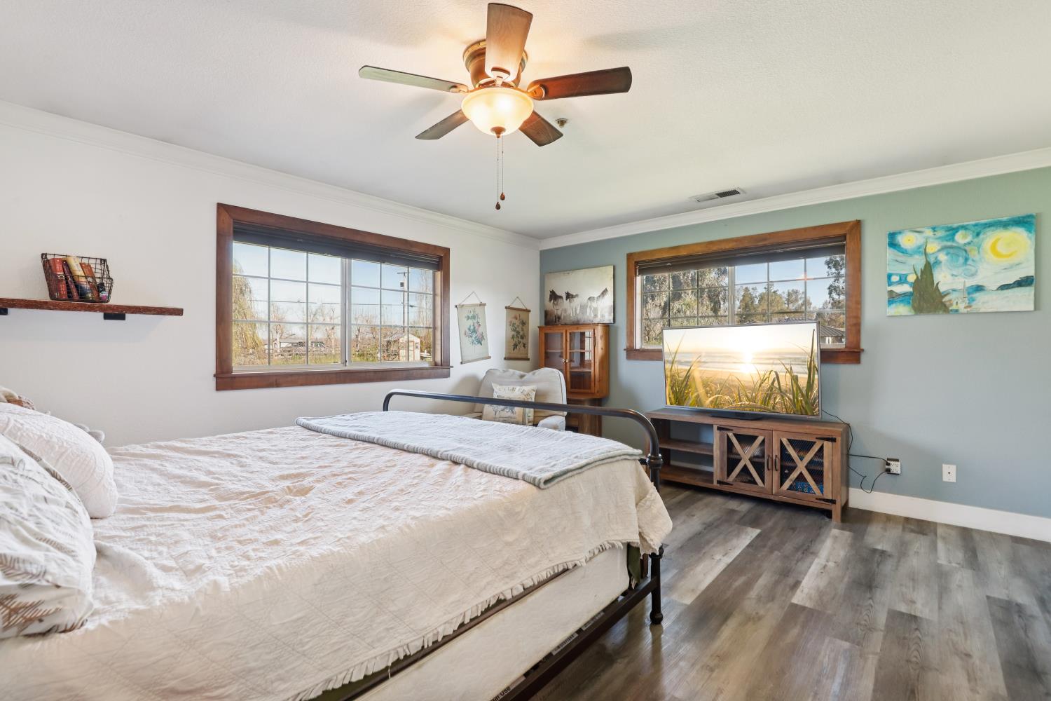 11213 Colony Road Wilton, CA 95693 - Photo 19 of 48 a bedroom with a bed and a flat screen tv