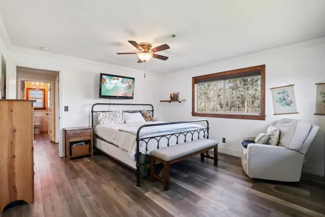 a spacious bedroom with a bed and a couch