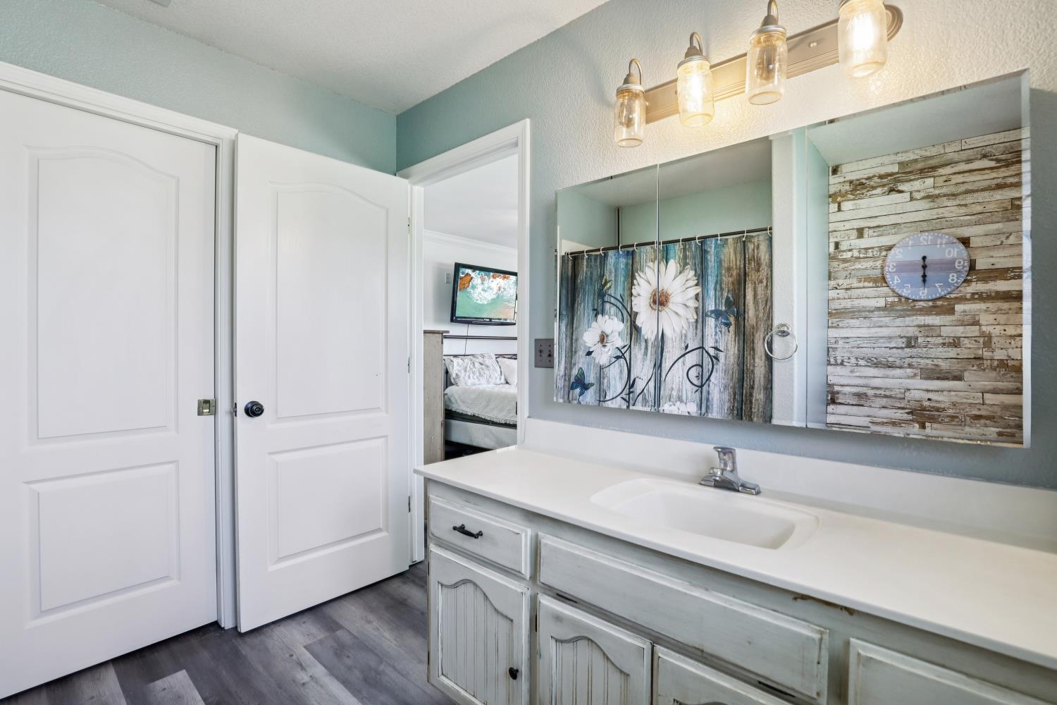11213 Colony Road Wilton, CA 95693 - Photo 24 of 48 a bathroom with a sink and a mirror