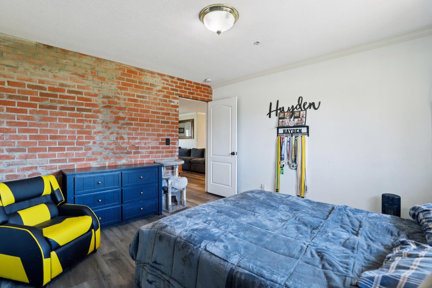 11213 Colony Road Wilton, CA 95693 - Photo 26 of 48 a bedroom with a bed and a couch