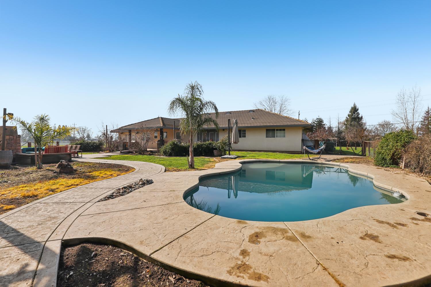 11213 Colony Road Wilton, CA 95693 - Photo 36 of 48 a view of a swimming pool with an outdoor seating