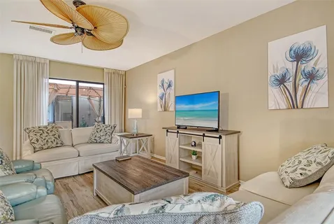 a view of a kitchen with a sink and a refrigerator