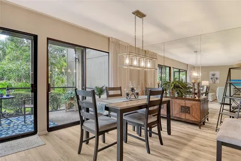 a dining room with furniture and window