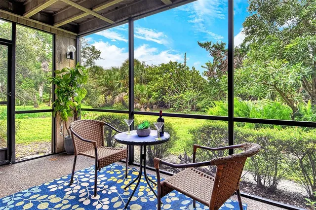 a bedroom with a large bed and a flat tv screen on dresser