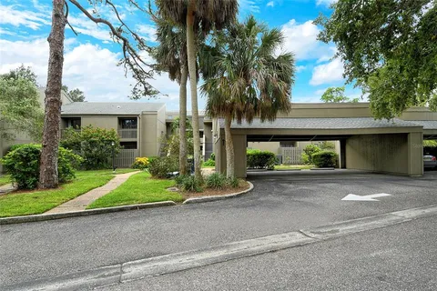 a view of a house with a flower garden