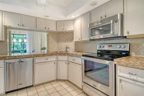 a view of a swimming pool with a yard