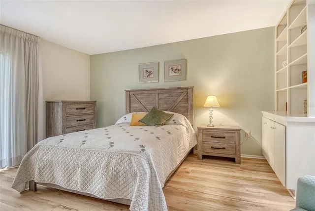 an aerial view of a tennis ground with large trees