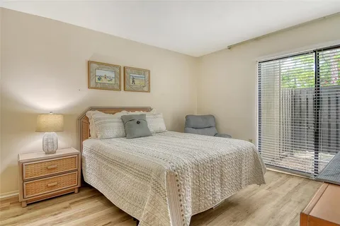 a view of a lake with boats in front of house
