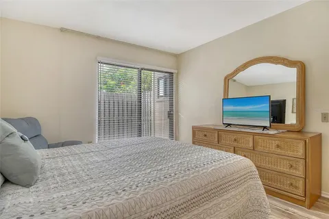 a view of a swimming pool with a deck and a garden
